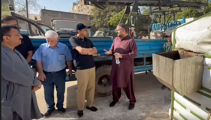 Karachi Mayor Barrister Murtaza Wahab is seen interacting with officials. — APP/File