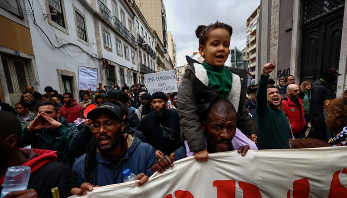 People shout slogans during a demonstration against the mounting costs of living, in Lisbon, Portugal, February 25, 2023. —Reuters