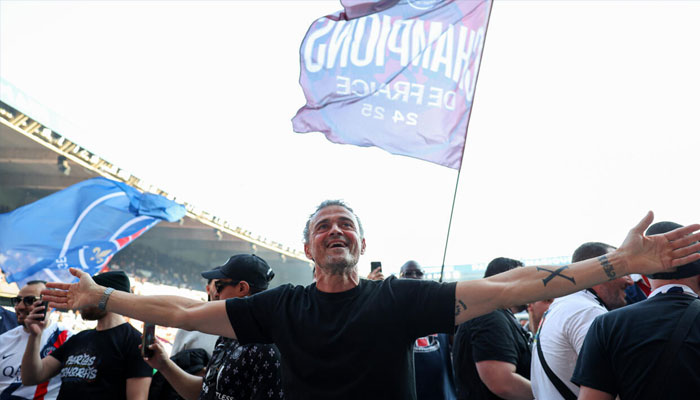 PSG coach Luis Enrique leads the celebrations after his side clinched the Ligue 1 title on Saturday, April 6 2025. —AFP