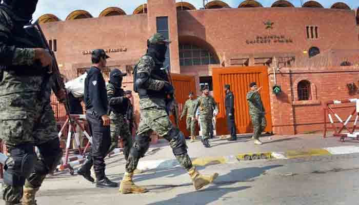 Security personels standing alert outside PCB building. —APP/File