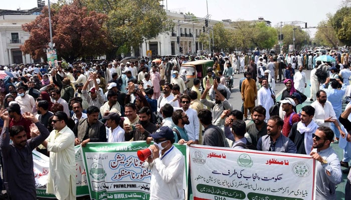 Activists of Grand Health Alliance hold protest demonstration for acceptance of their demands, outside Punjab Assembly building in Lahore on April 7, 2025. — PPI