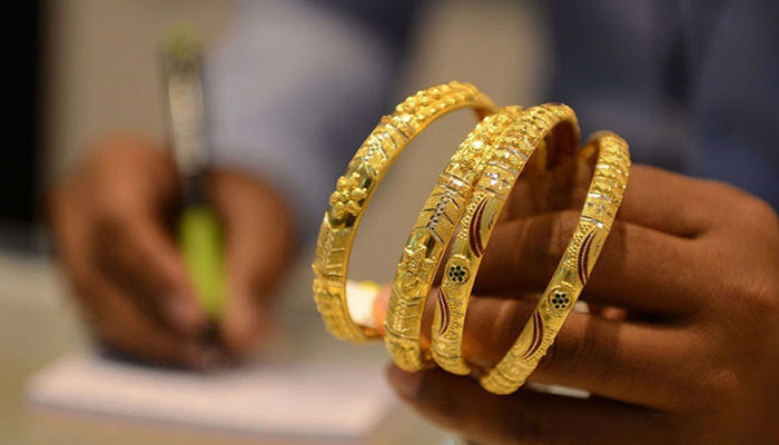 This undated file image shows a set of gold bangles. — AFP