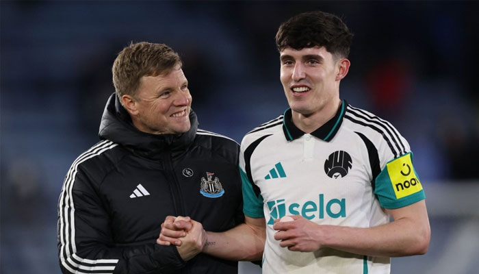Newcastle Uniteds English head coach Eddie Howe (left) celebrates with Newcastle Uniteds English defender Valentino Livramento on the pitch after the English Premier League football match between Leicester City and Newcastle United at King Power Stadium in Leicester, central England April 8, 2025. — AFP