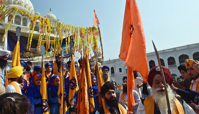 Priests march at the Gurdwara Panja Sahib, one of Sikhisms most holy places.— AFP/File