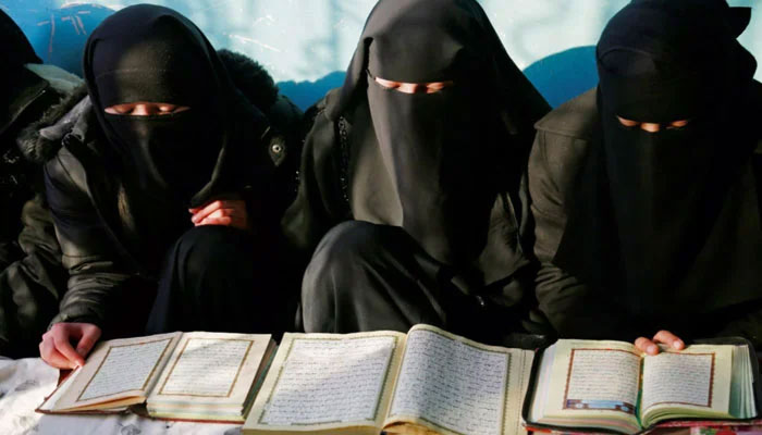 Girls seen reading holy quran in this undated image.— AFP/File