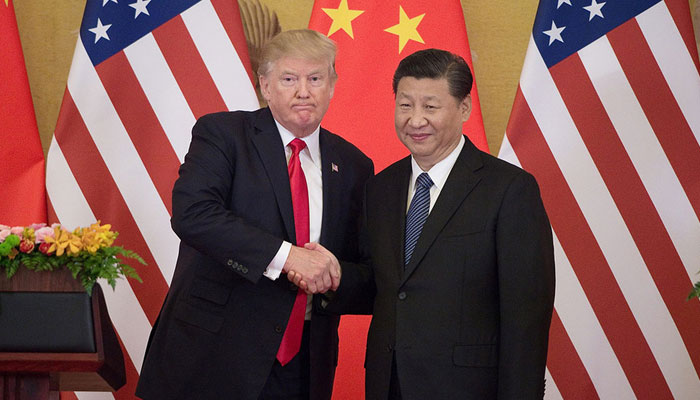US President Donald Trump shakes hands with Chinese counterpart Xi Jinping. — AFP/File