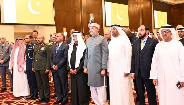 Pakistan’s ambassador to the United Arab Emirates (UAE) Faisal Niaz Tirmizi (centre right) stands with senior UAE officials in honor of Pakistans anthem during Pakistan’s 85th National Day on April 9, 2025. — Facebook@PakinUnitedArabEmirates