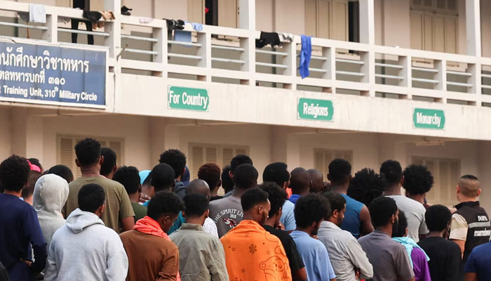Multinational victims of scam centres, who were trafficked into working in Myanmar and were sent to Thailand on February 12 amid a mounting crackdown on scam centres operating along a porous border, queue to get food at a shelter inside the 310th Military District (Fort Wachiraprakan), as they wait for their embassies to pick them up, in Tak province, Thailand February 19, 2025. — Reuters