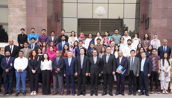 A high-level Chinese delegation pose for a photo during their visit to the NUST on April 10, 2025. — Facebook@nustofficial