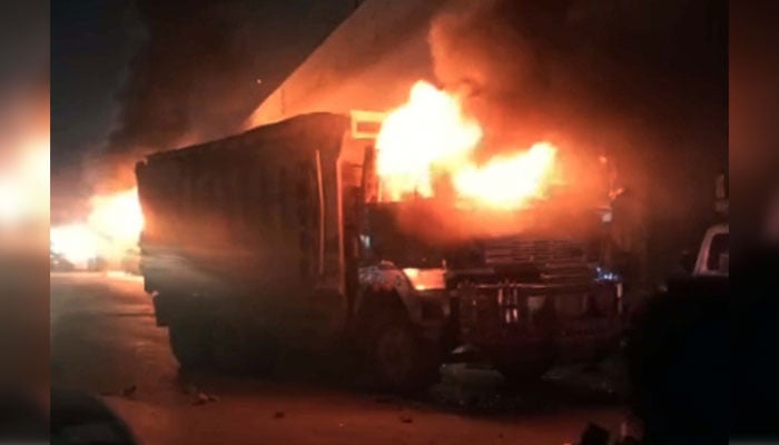 View of huge fire flames rise from burning dumpers after traffic accident, at Nagan Chowrangi area in Karachi on April 10, 2025. — PPI