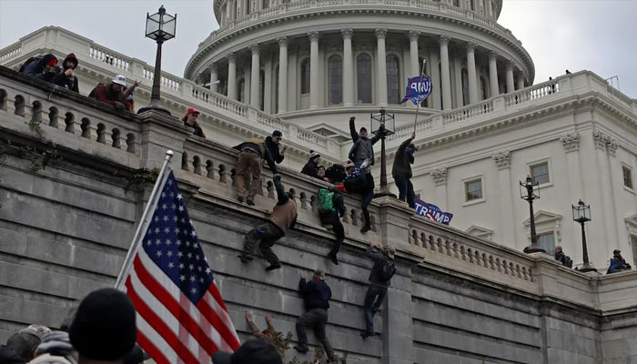 Supporters of US President Donald Trump climb a wall during a protest against the certification of the 2020 presidential election results by the Congress, at the Capitol in Washington, US, January 6, 2021. —Reuters