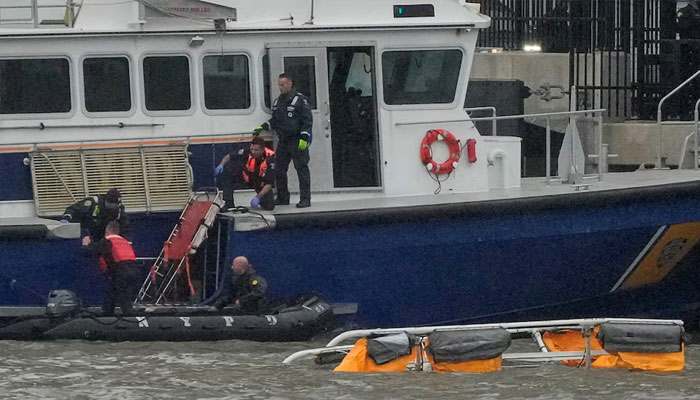 Rescue workers and emergency personnel work at the scene of a helicopter crash on the Hudson River near lower Manhattan in New York, as seen from Newport, New Jersey, US, April 10, 2025. —Reuters
