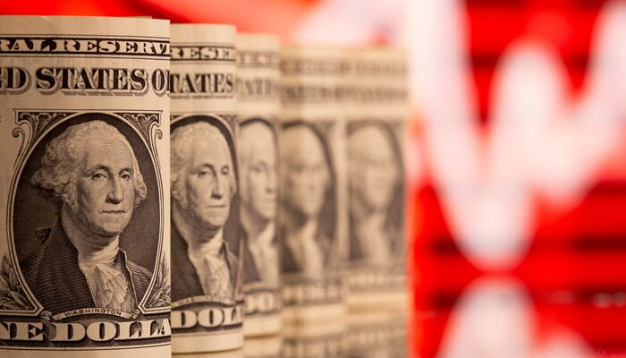 US One dollar banknotes are seen in front of displayed stock graph in this illustration taken, February 8, 2021. — Reuters