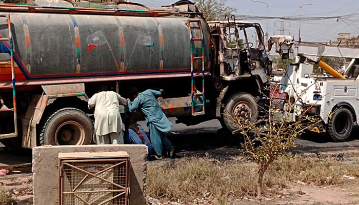 View of burnt heavy vehicles shift to police station under the supervision traffic police in Karachi on April 10, 2025. — PPI