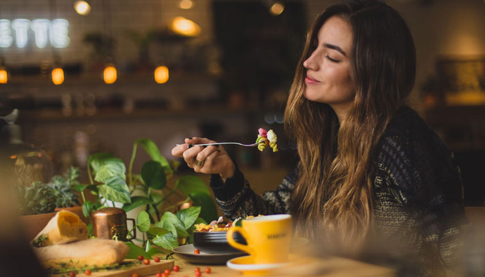 The representational image shows a woman having her meal. — Unsplash/File