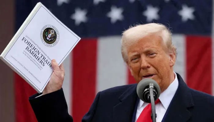 US President Donald Trump holds a signed executive order on cryptocurrencies, in the Oval Office of the White House, in Washington, US, January 23, 2025.— Reuters