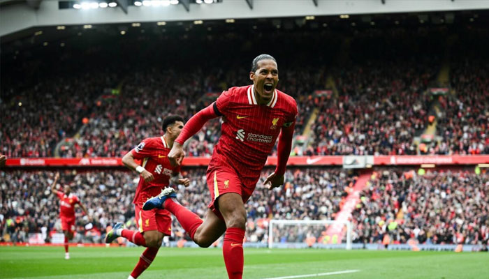 Liverpool defender Virgil van Dijk celebrates scoring against West Ham. —AFP/File