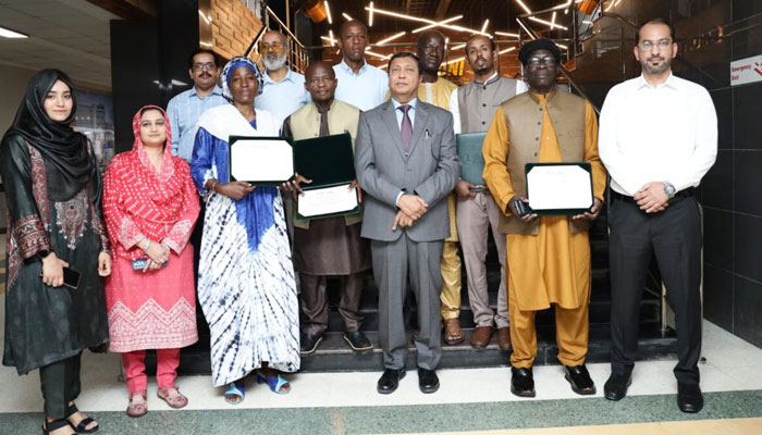 Coordinator General OIC-Comstech Prof. Dr Muhammad Iqbal Choudhary (centre) pictured with ophthalmologists who have successfully completed a one-year specialised training programme. — APP/File