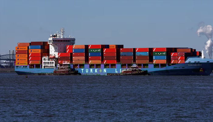 A cargo ship is brought into the Port of Elizabeth marine terminal seen from Bayonne, New Jersey, US, April 9 2025. —Reuters