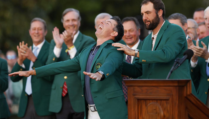 Northern Irelands Rory McIlroy reacts as he is awarded the green jacket by 2024 champion Scottie Scheffler after a playoff triumph over Justin Rose at Augusta National. —AFP/File