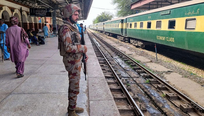 A paramilitary soldier stands guard at a railway station in the Sibi district of southwestern Balochistan province on March 12, 2025. — AFP