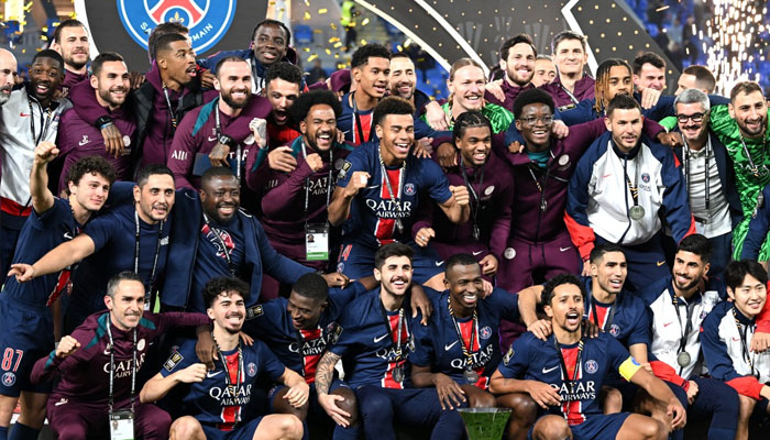 Paris Saint-Germain players celebrate with the trophy after winning the French Champions Trophy (Trophee des Champions) final football match between Paris Saint-Germain (PSG) and AS Monaco (ASM) at the Stadium 974 in Doha on January 5, 2025.—AFP