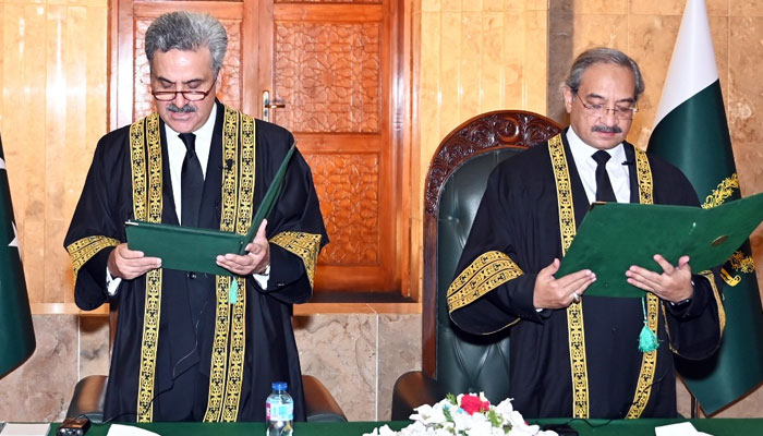 CJP Yahya Afridi (left) administers oath to Justice Ali Baqar Najafi as SC judge in Islamabad on April 15, 2025. — PID