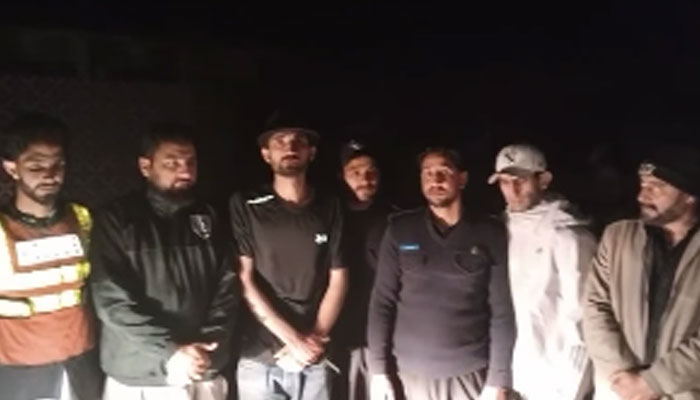 This screengrab taken on April 17, 2025, shows rescued tourists who had been stranded in the Mundi Top area of Siran valley. — Facebook@KpRescue1122