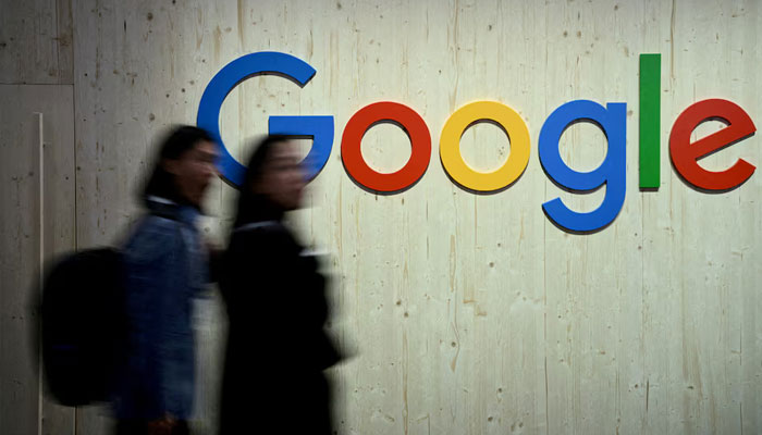 People walk next to a Google logo during a trade fair in Hannover Messe, in Hanover, Germany, April 22, 2024. — Reuters