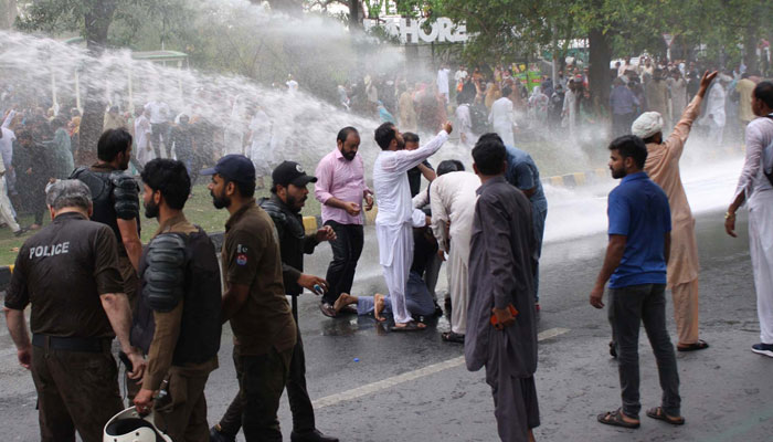 Police officials resort baton charge and use water cannons to repel protesters during the protest demonstration of Grand Health Alliance (GHA) against the privatisation of hospitals, basic health units and rural health centres in Lahore on April 18, 2025. — PPI
