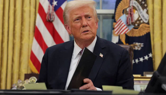 US President Donald Trump signs documents as he issues executive orders and pardons for January 6 defendants in the Oval Office at the White House on Inauguration Day in Washington, US, January 20, 2025. — Reuters