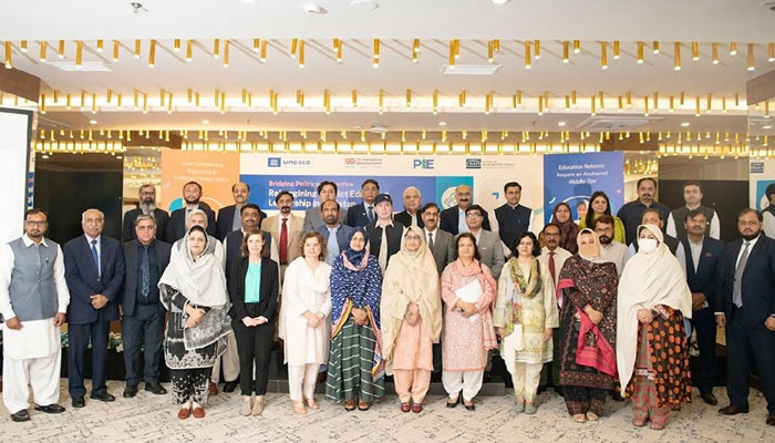 Participants pose for a group after a workshop on April 20, 2025. — Facebook@pie.gov.pk