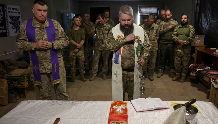 Ukraine troops at Easter service, Donetsk region. April 20, 2025. —Reuters