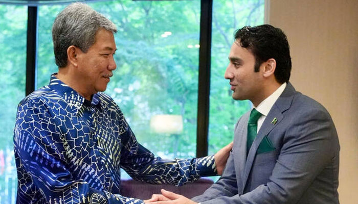 The handout photograph released by Pakistan’s Ministry of Finance on April 22, 2025, shows Malaysian Foreign Minister Mohamad bin Hajji Hasan (left) meets Bilal bin Saqib, head of the Pakistan Crypto Council (PCC), in Kuala Lumpur.— Ministry of Finance Pakistan