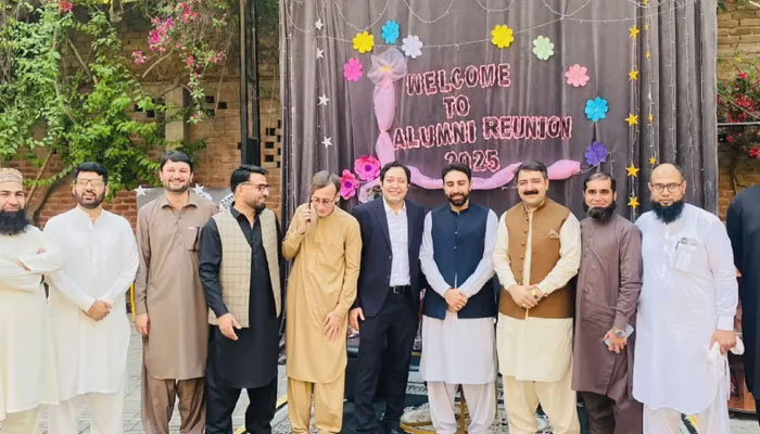 Alumni of the Peshawar Model School pose for a group photo at an Alumni Reunion Ceremony on April 14, 2025. — Screengrab via Facebook@Pmsboys3