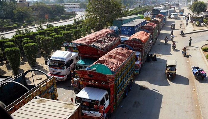 This representational image shows trucks queued up on a road in Karachi on November 26, 2017. — AFP