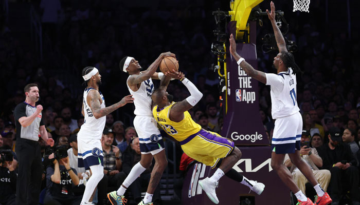 LeBron James of the Los Angeles Lakers attempts a shot while being guarded by Jaden McDaniels in the Lakers victory over the Minnesota Timberwolves in game two of their NBA playoff series. —AFP