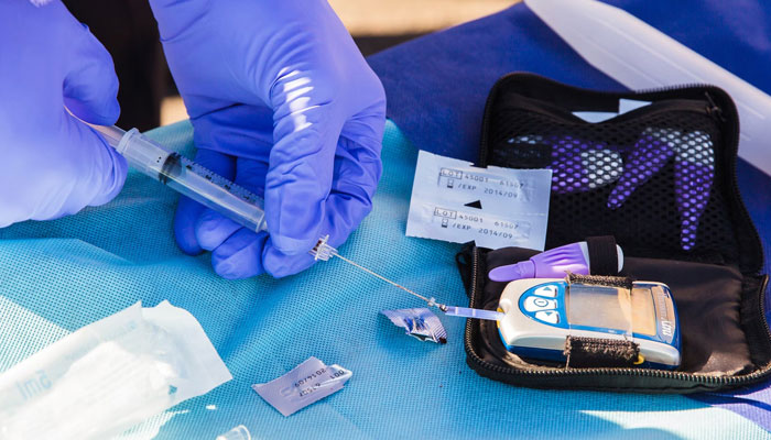 A representational image of a healthcare person performing a diabetic test. — Unsplash/File