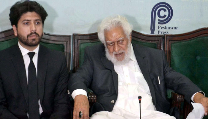 Senior lawyer and Pakistan Tehreek-e-Insaf (PTI) leader Qazi Muhammad Anwar (right) addresses to media persons during a press conference, at Peshawar press club on April 23, 2025. — PPI