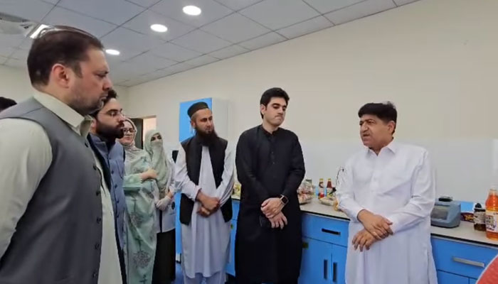 Minister for Food Zahir Shah Toru (right) visits to the under-construction Central Food Testing Laboratory in Hayatabad on April 23, 2025. — Screengrab via Facebook@Zahir Shah Toru