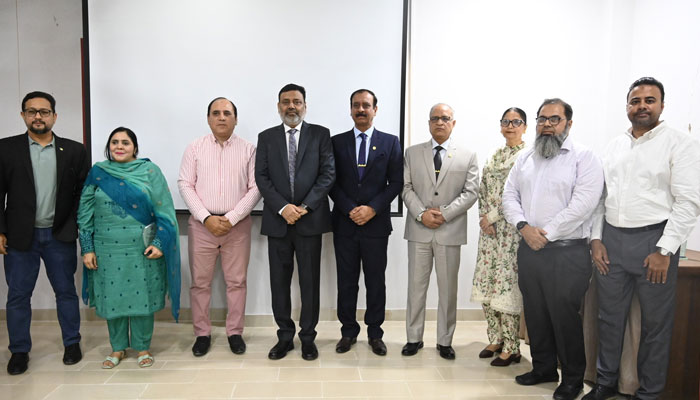Chief guest Major General Nayyar Naseer (centre) in a group photo during a seminar on ‘Climate Change and Disability; a New Frontier’ organised by the Dean of the Faculty of Education of the University of Karachi on April 23, 2025. — Facebook@uoktimes