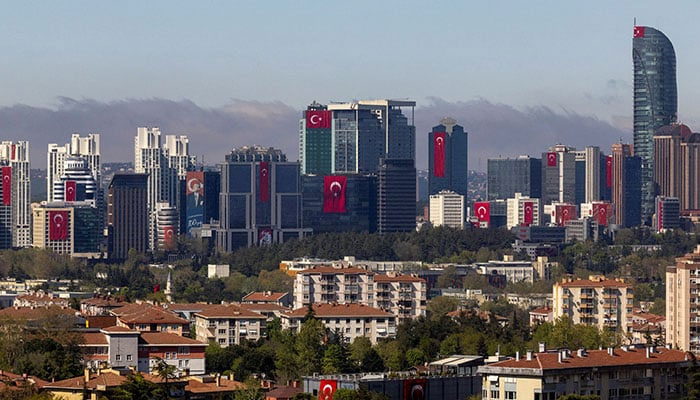 Turkiyes national flags are displayed on buildings a head of the National Sovereignty and Childs Day in the financial district of Istanbul, Turkiye, April 22, 2025. — Reuters