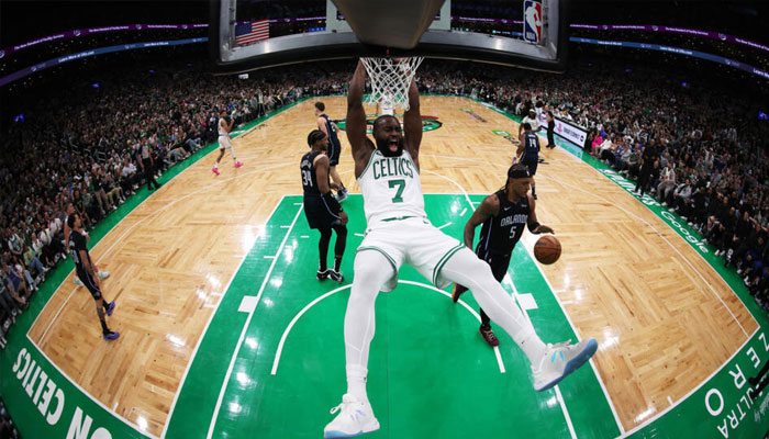 Bostons Jaylen Brown reacts after making a slam dunk in the Celtics NBA playoff victory over Orlando . —AFP
