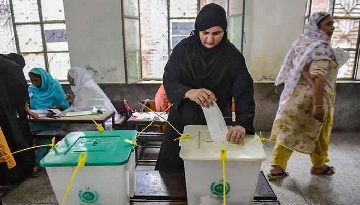 A representational image of woman casting her vote. — AFP
