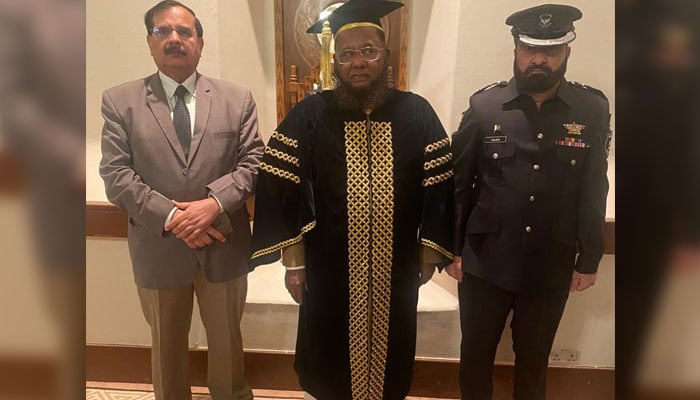 Federal Tax Ombudsman (FTO) Dr. Asif Mahmood Jah (centre) seen in this image. — APP/File