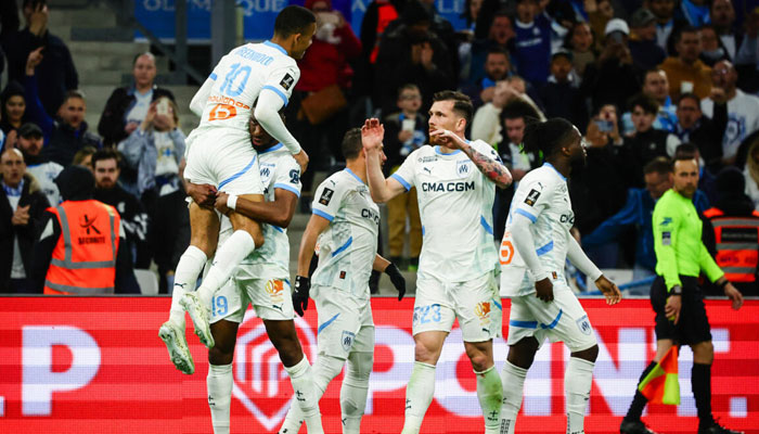 French giants Marseille team players celebrating. — AFP/File