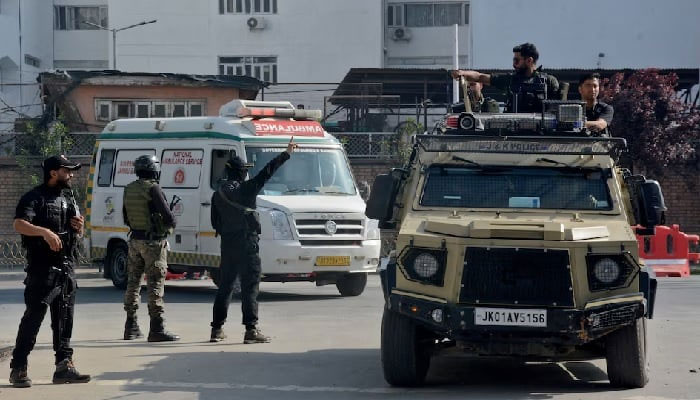 Indian security forces personnel escort an ambulance carrying the bodies of tourists who were killed in a suspected militant attack near Pahalgam, outside the police control room in Srinagar. — Reuters/ File