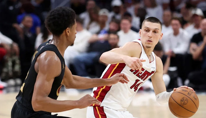 (From left) DeAndre Hunter of the Cleveland Cavaliers and Tyler Herro of the Miami Heat in action during the second quarter in Game Four of the Eastern Conference First Round NBA Playoffs at Kaseya Center. —AFP/File