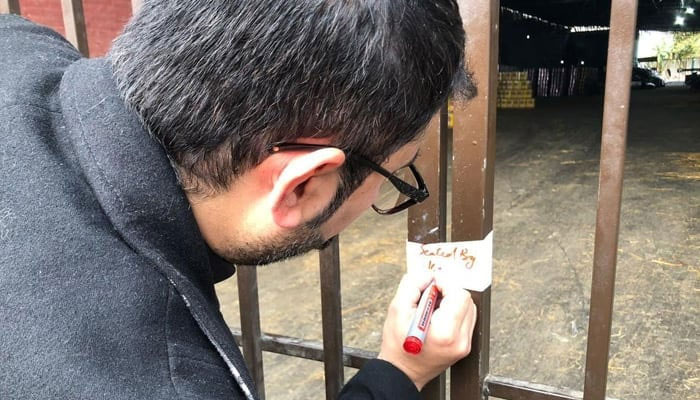 This representational image shows a Halal Food Authority Khyber Pakhtunkhwa official seal a mill on January 29, 2024. — Facebook@Khyber Pakhtunkhwa Food Safety & Halaal Food Authority