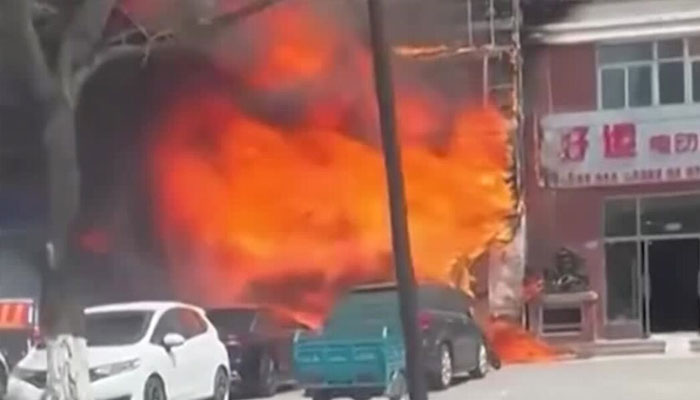 A restaurant can be seen under fire. —Reuters/File